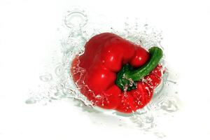 Red Pepper Splashing Into Water