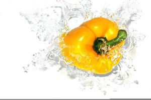 Yellow Pepper Splashing Into Water photo