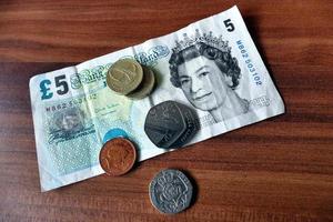 Five Pound Note And Coins photo