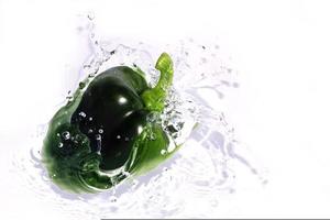 Green Pepper Splashing Into Water photo
