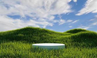 White minimal podium in green grassland with blue sky background. Nature concept. 3D illustration rendering photo