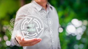 human are raising the planet to save energy,and reduce global warming,idea for environment conscious business,carbon credit,reducing greenhouse gas emissions,ESG for Environment Social and Governance photo