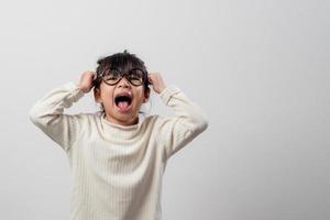 Sad little girl holds his head. little girl feeling sick, having headache. photo