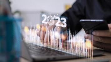 Business and Technology target set goals and achievement in 2023 new year resolution statistics graph rising revenue, planning to start up strategy, icon concept photo