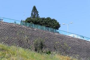 High wall made of stone and concrete. photo