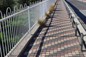 Pavement along the road for pedestrian traffic. photo