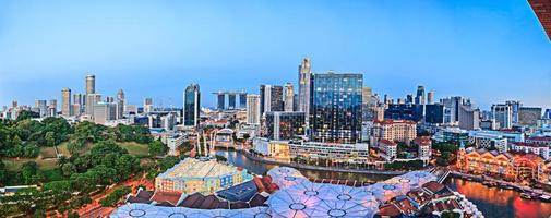 Aerial panoramic picture of the Singapore skyline during evening twilight in summer photo