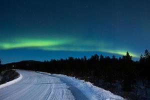 Northern lights, aurora borealis, in lapland Finland photo