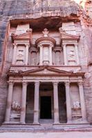 Ancient Nabataean Treasury carved out of rock at Petra photo