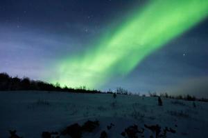 Northern lights, aurora borealis, in lapland Finland photo