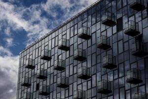 Steel background of glass high rise building photo