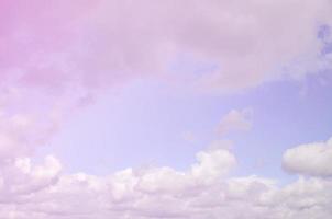 A photo of a bright and shiny blue sky with fluffy and dense whi