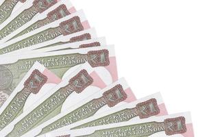 1 Indian rupee bills lies isolated on white background with copy space stacked in fan close up photo