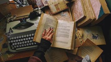 Vintage Desk Top Setting With Old Books And Typewriter photo
