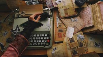 Vintage Desk Top Setting With Old Books And Typewriter photo