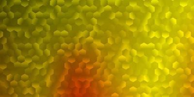 Light yellow vector backdrop with a batch of hexagons.