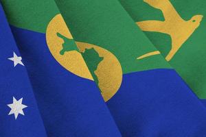 Christmas island flag with big folds waving close up under the studio light indoors. The official symbols and colors in banner photo