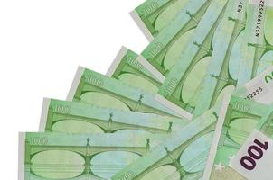 100 Euro bills lies in different order isolated on white. Local banking or money making concept photo