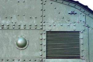 Abstract green industrial metal textured background with rivets and bolts photo