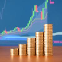 Golden coin stacks arranged as a graph. Increasing columns of coins photo