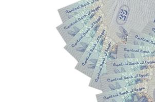 25 Egyptian piastres bills lies isolated on white background with copy space. Rich life conceptual background photo