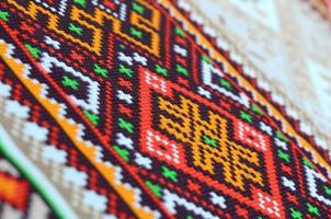 Traditional Ukrainian folk art knitted embroidery pattern on textile fabric photo