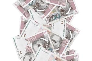 200 Croatian kuna bills flying down isolated on white. Many banknotes falling with white copyspace on left and right side photo