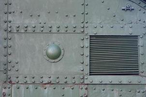 Abstract green industrial metal textured background with rivets and bolts photo