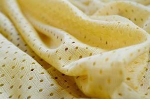 Yellow mesh sport wear fabric textile background pattern photo