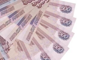 500 russian rubles bills lies isolated on white background with copy space stacked in fan shape close up photo