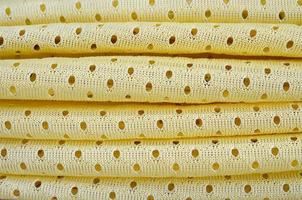 Yellow mesh sport wear fabric textile background pattern photo