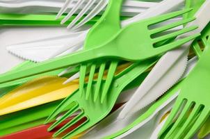 Pile of bright yellow, green and white used plastic kitchenware appliances photo