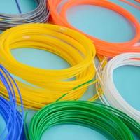 Plastic PLA and ABS filament material for printing on a 3D pen or printer of various colors photo