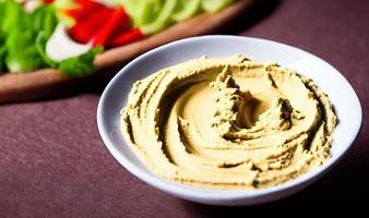 Healthy food. Traditional freshly made organic hummus. photo