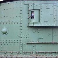 Texture of tank side wall, made of metal and reinforced with a multitude of bolts and rivets photo