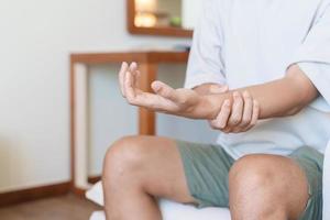 man having wrist pain because using smartphone or computer long time. De Quervain s tenosynovitis, rheumatism, arthritis, osteoarthritis, ergonomic, Carpal Tunnel Syndrome or Office syndrome photo