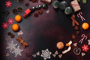 Christmas pie stollen with marzipan, berries and nuts on a dark concrete background photo