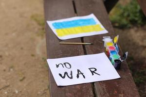 Children's drawings against the war in Ukraine. A call for peace, a drawing of the Ukrainian flag and a heart in yellow and blue color. High quality photo