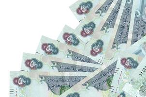 500 UAE dirhams bills lies in different order isolated on white. Local banking or money making concept photo