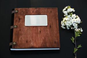 wooden photobook on the table. place for the inscription. top view photo