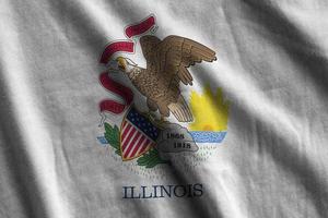 Illinois US state flag with big folds waving close up under the studio light indoors. The official symbols and colors in banner photo