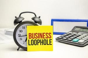 business loophole words on paper with tax forms photo