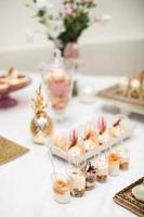 beautifully decorated table with sweet candy bar photo