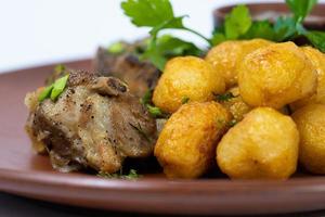 delicious baked meat with potatoes photo