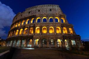 rome, italy, colosseum old ancient building gladiator battle at night. photo