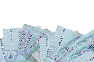 5 Ukrainian hryvnias bills lies on bottom side of screen isolated on white background with copy space. Background banner template photo