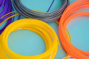 Plastic PLA and ABS filament material for printing on a 3D pen or printer of various colors photo