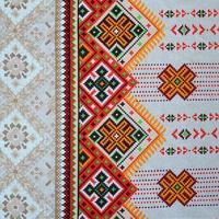 Traditional Ukrainian folk art knitted embroidery pattern on textile fabric photo