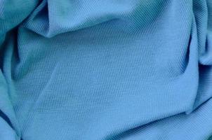 The texture of the fabric in blue color. Material for making shirts and blouses photo