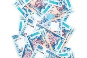 50 Sri Lankan rupees bills flying down isolated on white. Many banknotes falling with white copyspace on left and right side photo